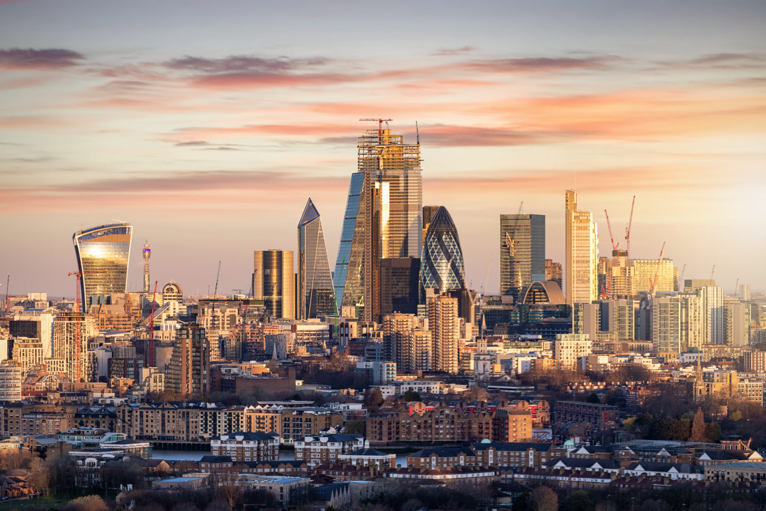 Aerial cityscape shot of London, UK at sunset