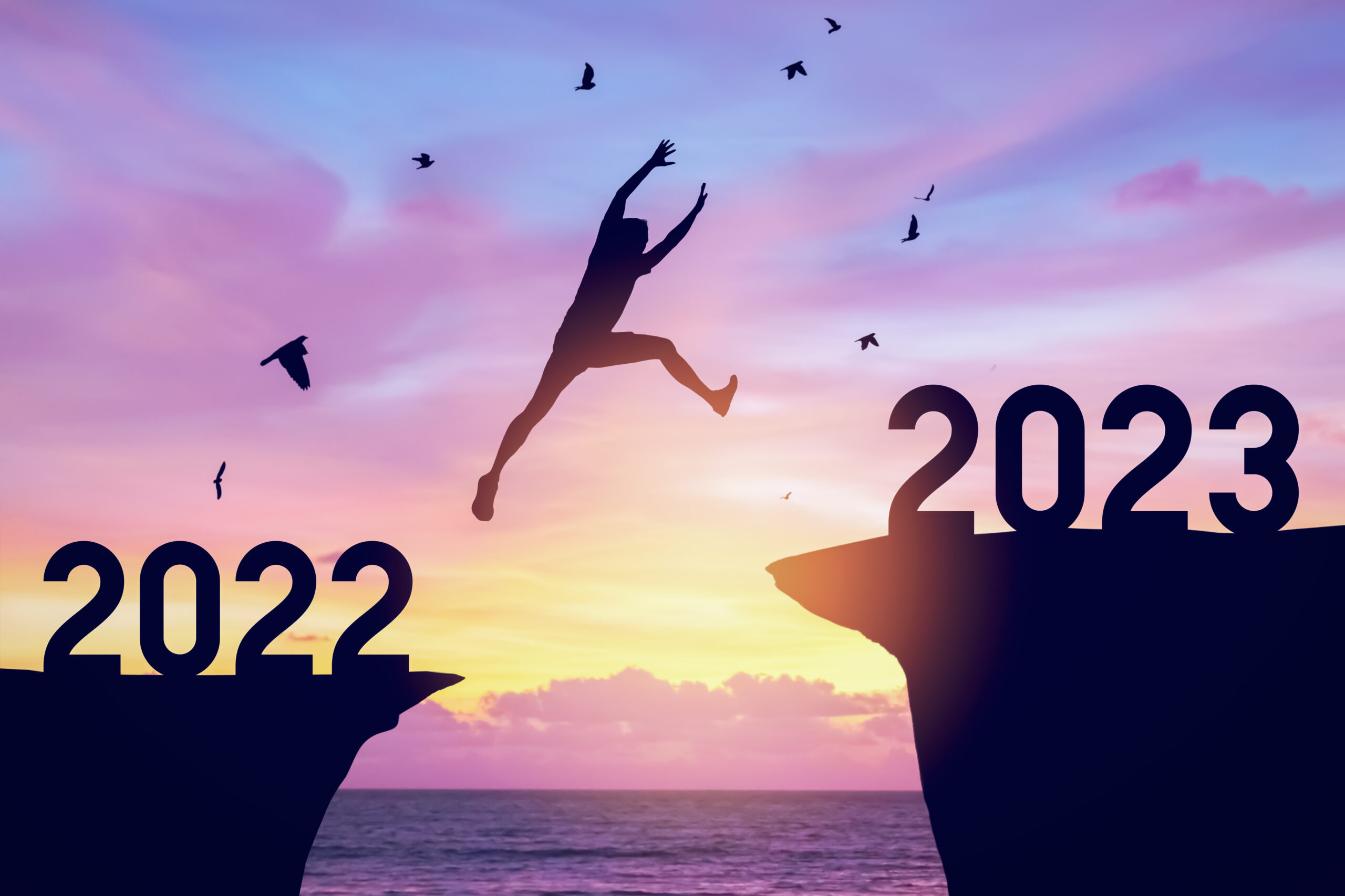 Person jumping from a ledge featuring 2022 to a ledge featuring 2023
