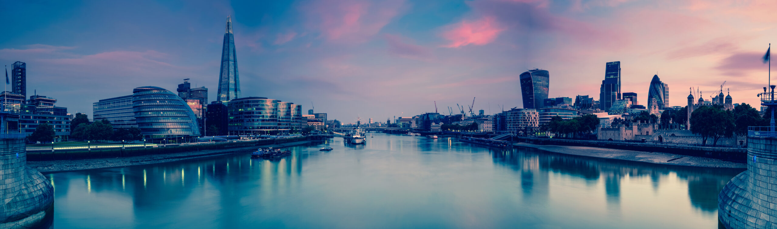 Panoramic view on London and Thames at twilight, from Tower Bridge with vintage effect effect