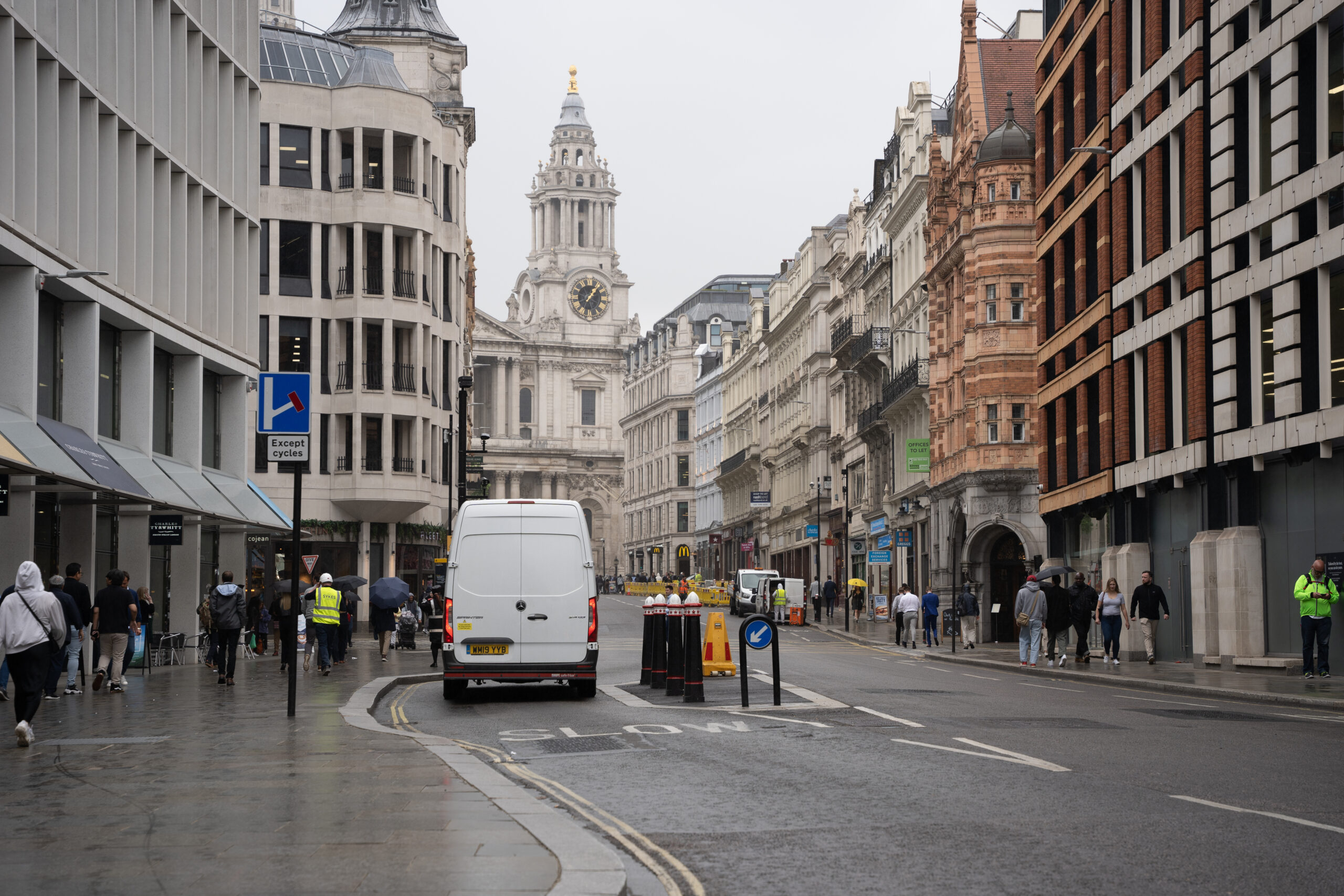 White van next to double yellow lines on the kerbside / curbside on a street in London, UK