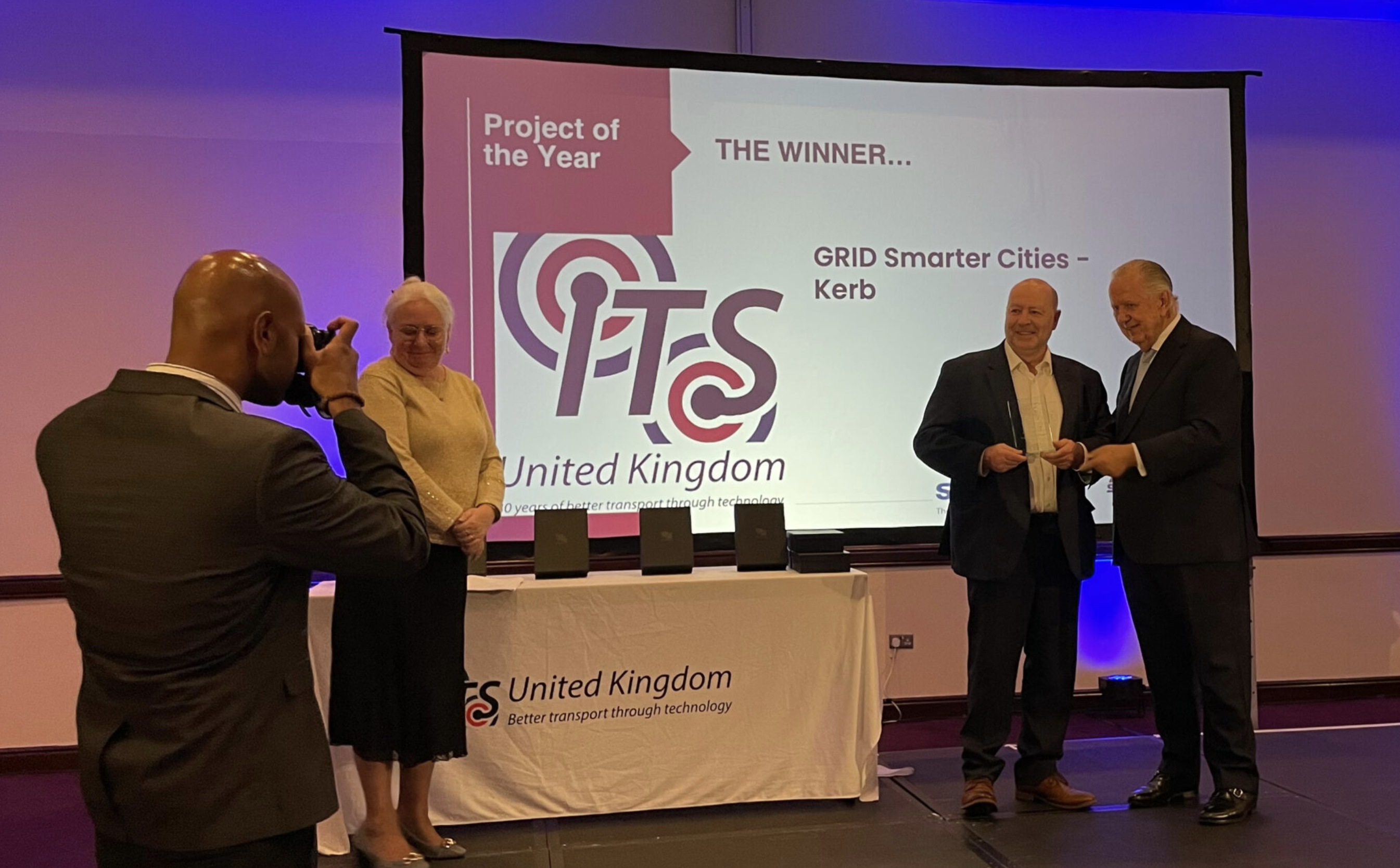 Neil Herron, CEO & Founder of Grid Smarter Cities, accepting the ITS UK Project of the Year award for Kerb